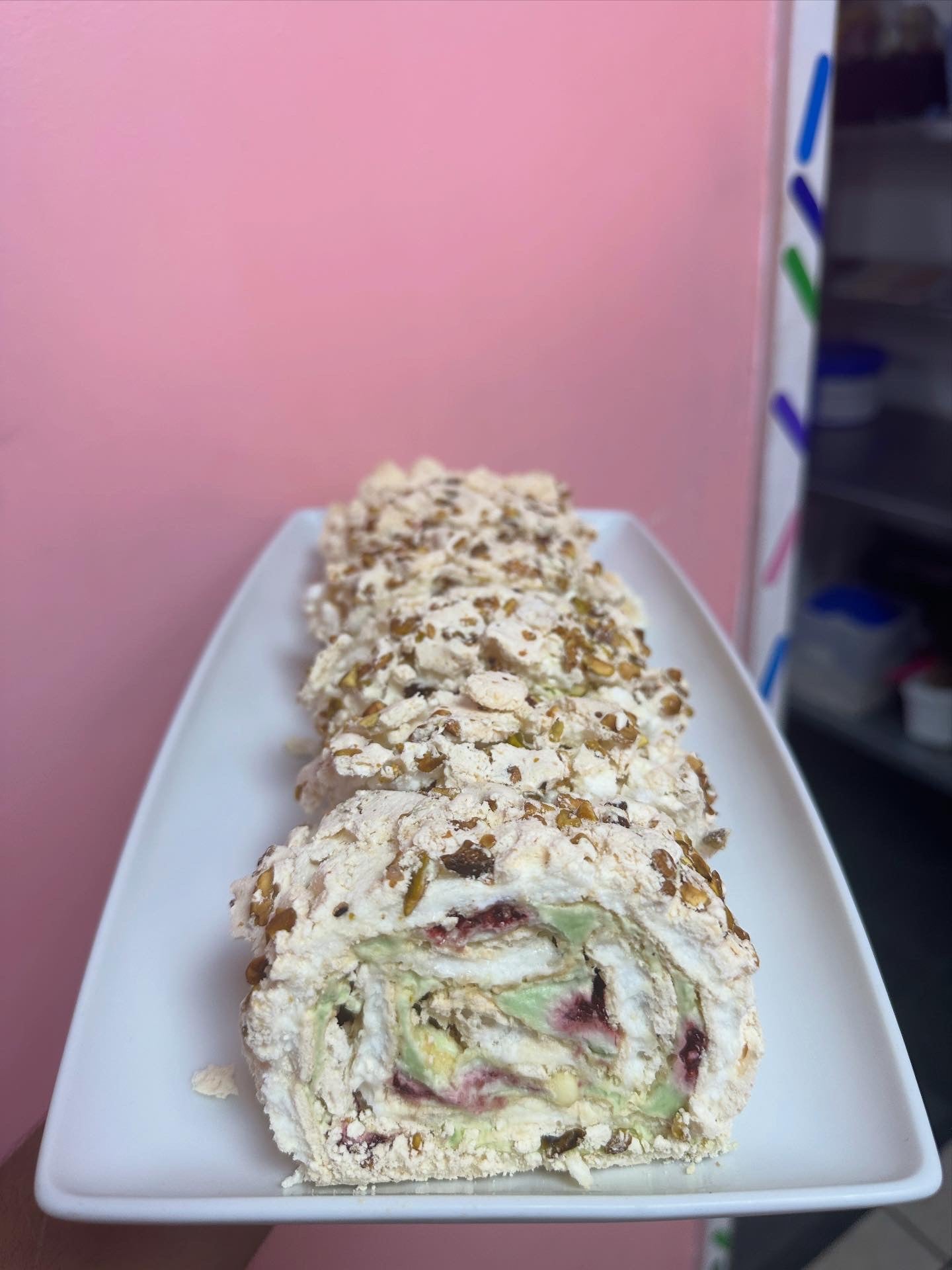 Pistachio white chocolate & raspberry Roulade